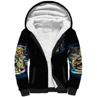 Black sherpa hoodie with white fleece-lined hood and colorful sleeve skull prints
