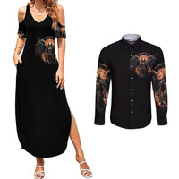Black long-sleeve button shirt with warrior skull graphic on sleeves and chest