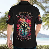 Black Hawaiian shirt back view with 'Whole World' skull couple floral graphic