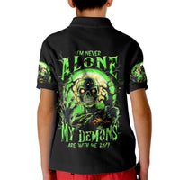 Kids black polo shirt with large green zombie skull graphic on back