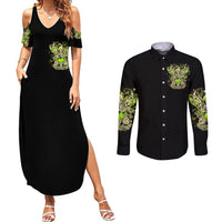 Black sleeveless maxi dress and black long-sleeve button shirt with green fairy graphic