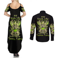Black fairy skull maxi dress and black long-sleeve button shirt with green graphic print