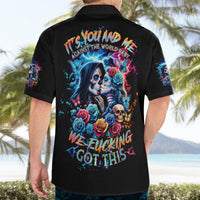 Black short-sleeve button-up Hawaiian shirt worn from the back with skull and rose graphic