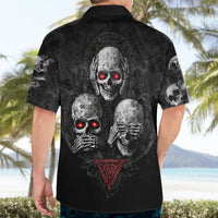 Black skull Hawaiian shirt on model, back graphic with red glowing eyes and triangle emblem