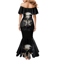 Black off-shoulder mermaid dress with large skull graphic on back and flared hem