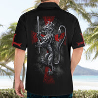 Black short-sleeve Hawaiian shirt with lion crest graphic, red splatter accents, back view.