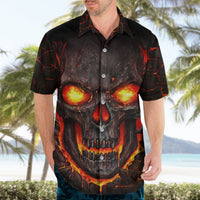 Black Hawaiian-style button shirt with glowing-eyed skull graphic, short sleeves, front.
