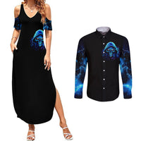 Black sleeveless maxi dress with blue skull flame print; black button shirt front