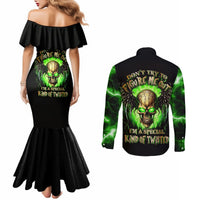 Black mermaid dress with green skull print and matching long-sleeve button shirt