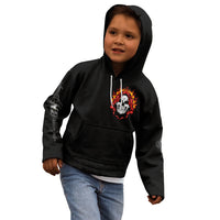 Black hoodie worn by child, front flaming skull graphic and kangaroo pocket