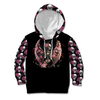 Black kid zip hoodie with hood up, angel skull chest graphic, pink rose-and-skull sleeves.
