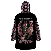 Black wearable blanket hoodie with skull, wings, and pink rose graphic on back