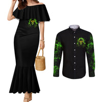Black off-shoulder mermaid dress and black long-sleeve button shirt, green skull chest print