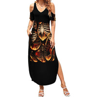 Black cold-shoulder maxi dress with flame skull skeleton graphic and V-neck