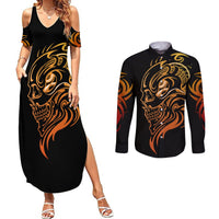 Black maxi slip dress and black long-sleeve button shirt with gold skull graphic