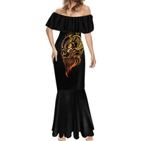 Black mermaid maxi dress with off-shoulder ruffle, gold skull tattoo graphic