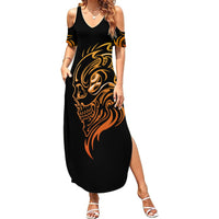 Black cold-shoulder maxi dress with golden tattoo skull graphic, slit hem