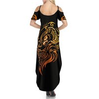 Black maxi dress with back scoop neckline and golden tattoo skull design