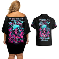 Black off-shoulder short dress with skull graphic on back, paired with black shirt back print