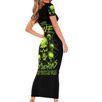 Black short-sleeve bodycon dress with neon green skull graphic front and sleeves