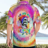 Rainbow tie-dye Hawaiian shirt on model, back text 'WE ARE ALL HUMAN' with skull