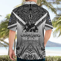 Black and gray Hawaiian-style short-sleeve button-up shirt, back shows large “Champions” print.
