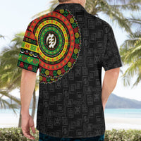 Mens black Hawaiian shirt back view with colorful circular emblem and repeating symbol pattern