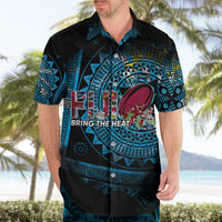 Rugby-style Hawaiian shirt on man, black with blue tribal print and Fiji graphic