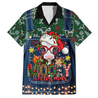 Christmas Hawaiian shirt with cow in red hat and glasses, bold holiday graphic on blue denim