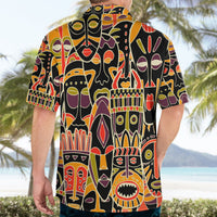 Adult black Hawaiian shirt with colorful tribal mask print, back view