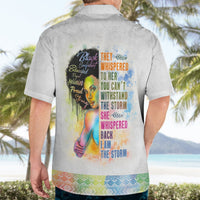Light gray Hawaiian shirt with collar and back colorful graphic; worn by a man.