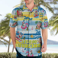 Blue tropical button-up shirt on model, cartoon Santa surfing with palm trees