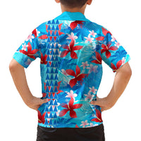 Blue Hawaiian shirt back view with surfboard-like wave graphics, hibiscus and plumeria