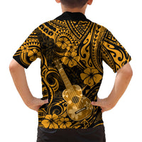 Kids short-sleeve Hawaiian shirt back view, black with gold hibiscus and ukulele pattern