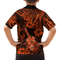 Orange and black Hawaiian button-up shirt back, hibiscus and ukulele print.