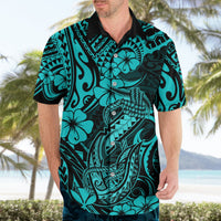 Turquoise Hawaiian shirt on model with black collar and hibiscus fish hook tribal design