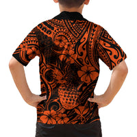 Orange and black pineapple floral Hawaiian shirt, short sleeves, back view with tribal swirls