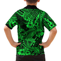 Kids Hawaiian shirt back view with green-and-black Polynesian tiki pattern, short sleeves