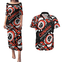 Black Hawaiian shirt and matching dress with red, white, and Haida-style eye pattern