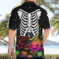 Black skeleton ribcage Hawaiian shirt on adult model, back view, “Trick or Treat”