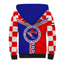 Sherpa hoodie, blue back with Croatia coat of arms, red-and-white check sleeves.