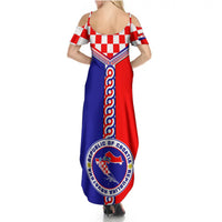 Women’s maxi dress back view with thin straps, red-and-blue crest and checker pattern
