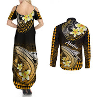 Black gold floral maxi dress and long-sleeve button shirt back view with Polynesian shark print