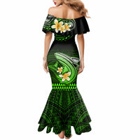 Off-shoulder mermaid maxi dress with green tribal shark and flower print, flared hem