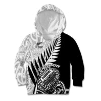 Kids’ black rugby hoodie with white Maori-inspired print, hood and kangaroo pocket