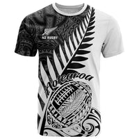 White rugby T-shirt with black Aotearoa-style tribal fern and leaf graphic