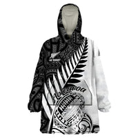 Wearable blanket hoodie with black-and-white Maori tribal print and hood