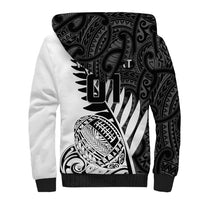 White sherpa hoodie with large black graphic print on back and hood
