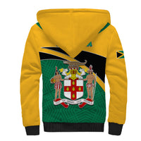 Sherpa hoodie with yellow back panel, white-lined hood, Jamaica crest emblem and green pattern