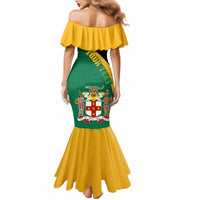 Off-shoulder mermaid dress, green with coat-of-arms graphic and yellow flared hem